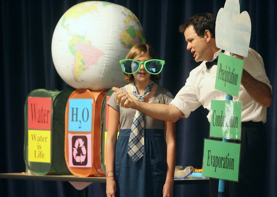 t.earthcapades.1.120209.db.jpg/
Photo by Don Boomer/
Hans Christensen Middle School sixth-grader Marisa Ghilarducci assists Tom Rayburn, aka, "Tom Foolery" as he discussed the world's water cycle during a Earthcapades assembly for students who have achieved at least a 3.0 grade point average at the school